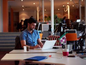 startup business, software developer working on computer